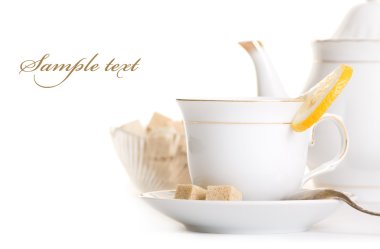 Tasty tea with lemon and sugar isolated over white clipart