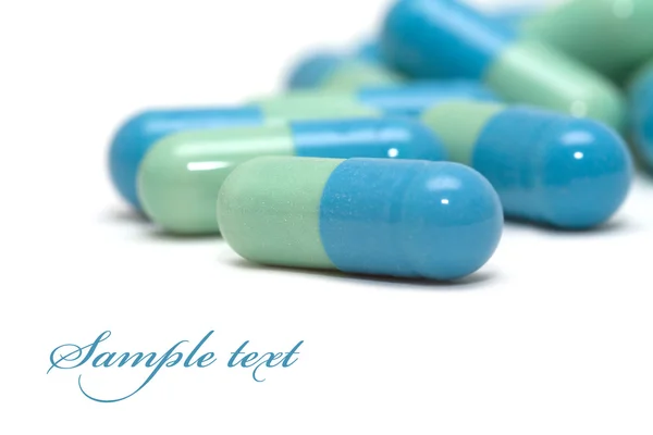 Kék-zöld tabletták — Stock Fotó