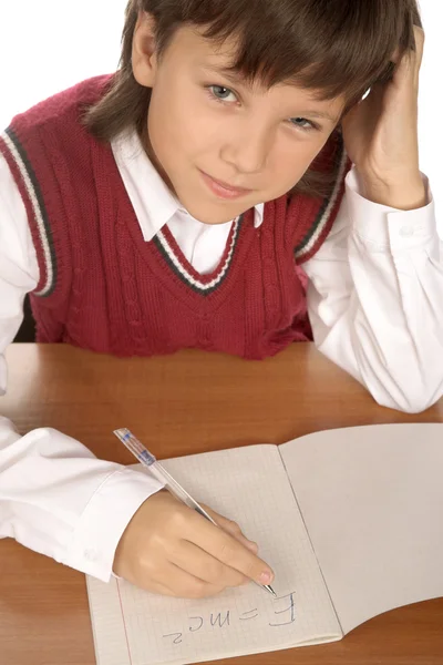 Schoolboy writing formula — Stock Photo, Image