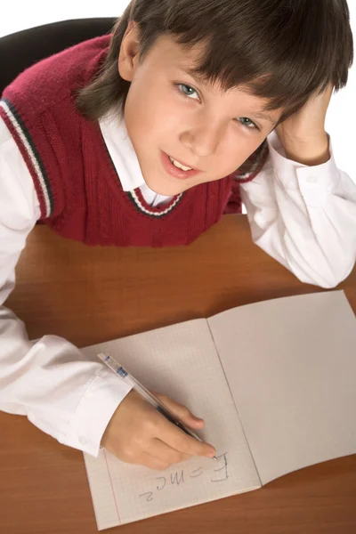 Schoolboy writing formula — Stock Photo, Image