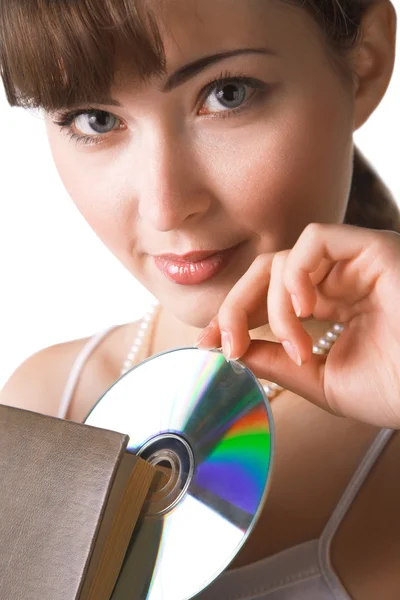 stock image Woman holding big book and compact disk