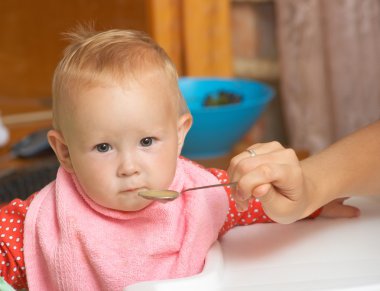 Baby food with a spoon clipart