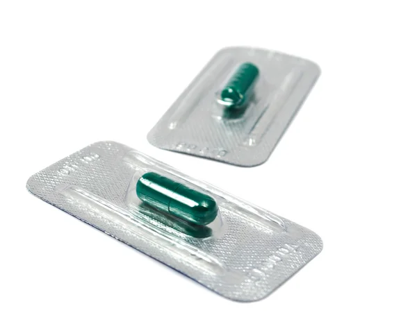 Green capsules — Stock Photo, Image