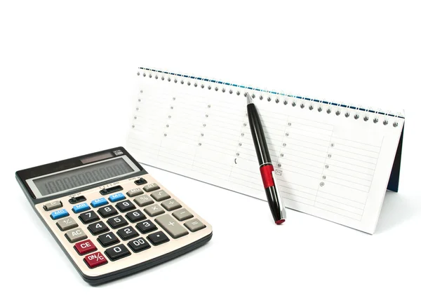 Calculator, een pen, een dagboek — Stockfoto