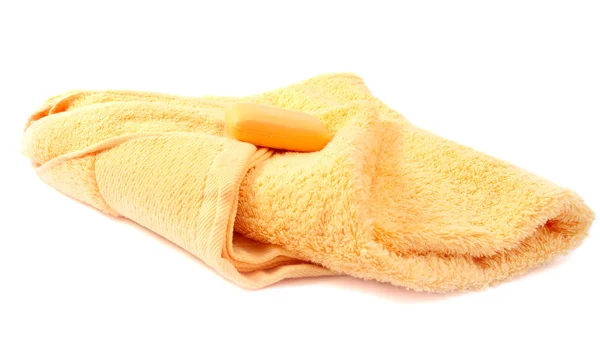 Жовтий рушник і мило — стокове фото