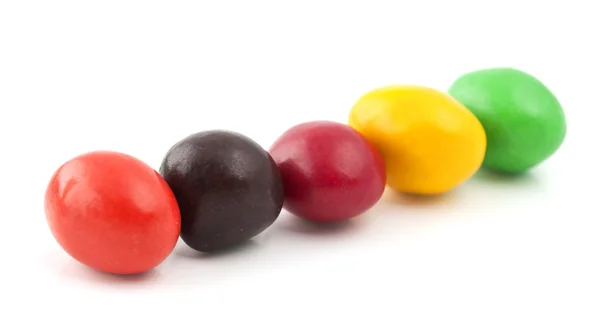 Таблетки з арахісом, покриті різнокольоровою глазур'ю — стокове фото