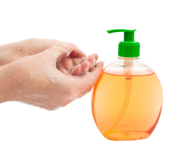 Lathered 的手和白色背景上的液体肥皂 — 图库照片