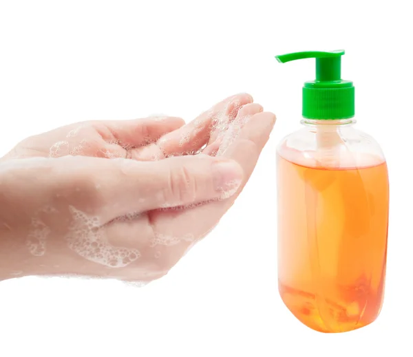 Lathered 的手和白色背景上的液体肥皂 — 图库照片