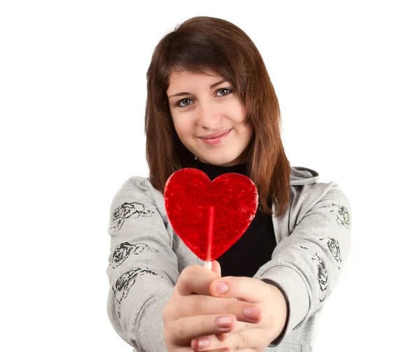 Mädchen Mit Einem Herzförmigen Bonbon Auf Weißem Hintergrund — Stockfoto