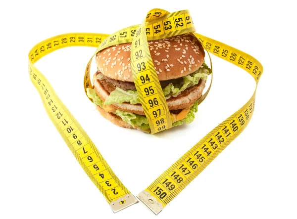 Чизбургер и сантиметр — стоковое фото