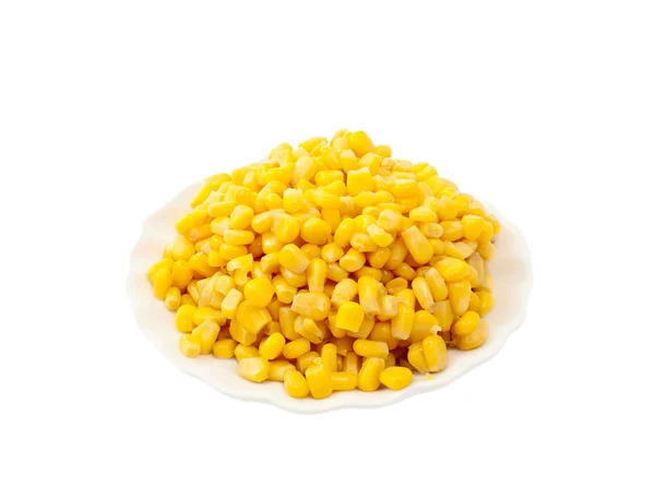 Kukuřice konservovaná na talíři — Stock fotografie