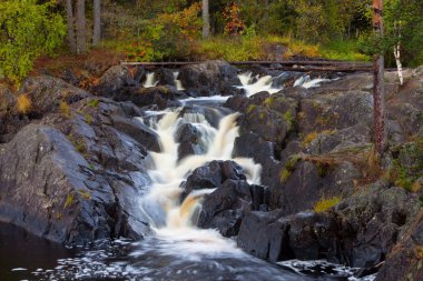 Mountain waterfall. fast stream water. autumn landscape