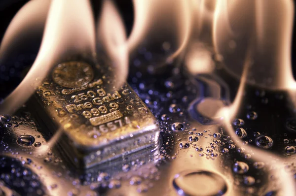 stock image Goldbars and flame