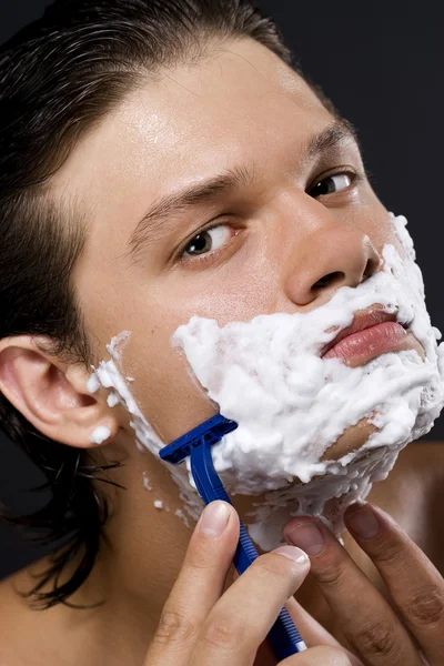 Handsome man shaving — Stock Photo, Image