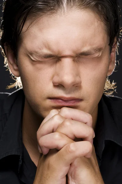Young man praying — Stock Photo, Image