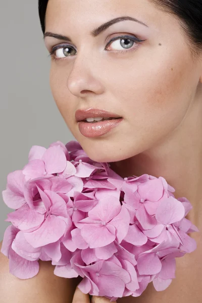 Beautiful woman with flower — Stock Photo, Image