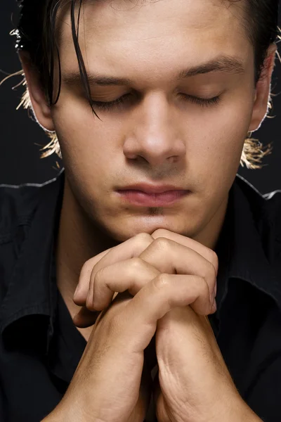 Young man praying — Stock Photo, Image