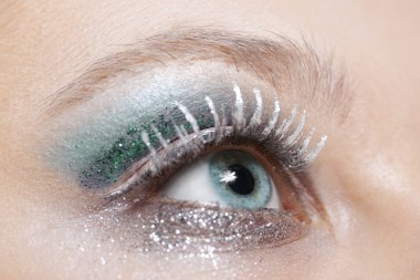 Eye with blue and silver sparkle make-up clipart