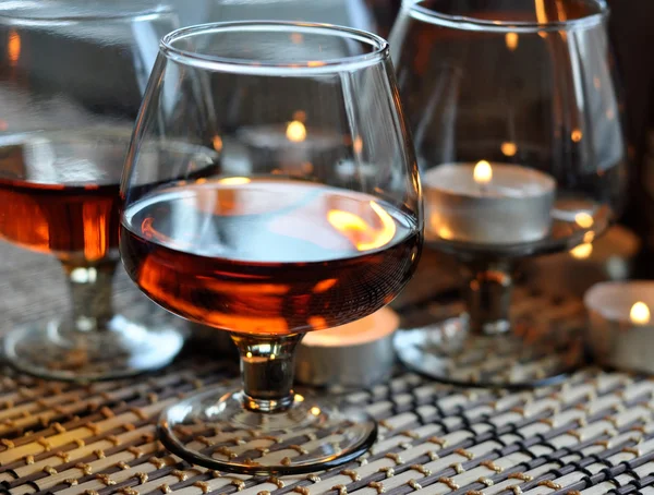 Brandy and candles — Stock Photo, Image