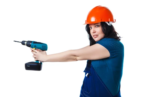 Pretty woman in coveralls with the drill — Stock Photo, Image
