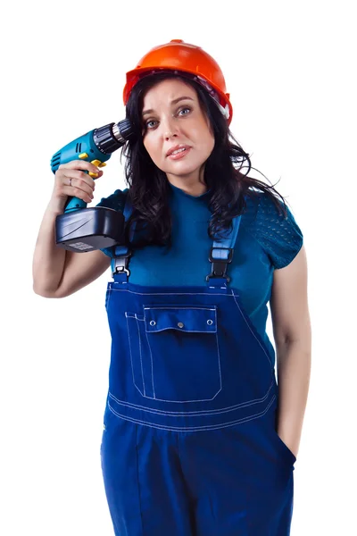 Pretty woman in coveralls with the drill. — Stock Photo, Image