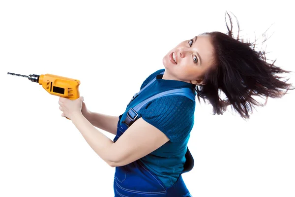 Pretty woman in coveralls with the drill. — Stock Photo, Image