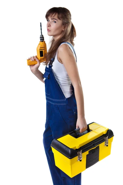 Pretty woman in coveralls with the drill and case — Stock Photo, Image