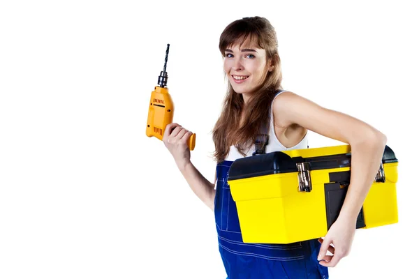 Pretty woman in coveralls with the drill and case — Stock Photo, Image