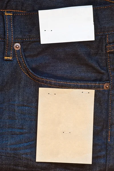 Jeans Blu Scuro Con Due Etichette Carta Vuote Fotografia Stock