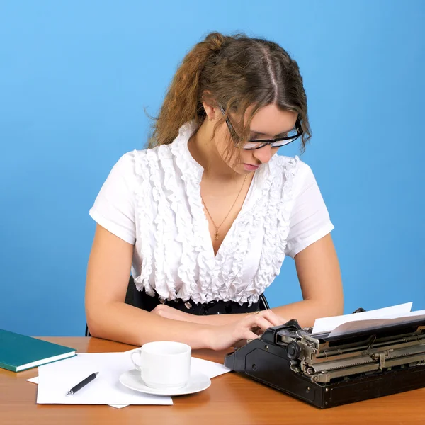 Cute female author with vintage typewriter — Stock Photo, Image