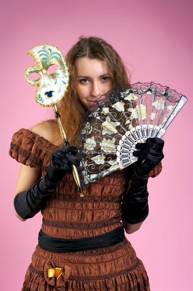 Cute young woman with carnival mask — Stok fotoğraf