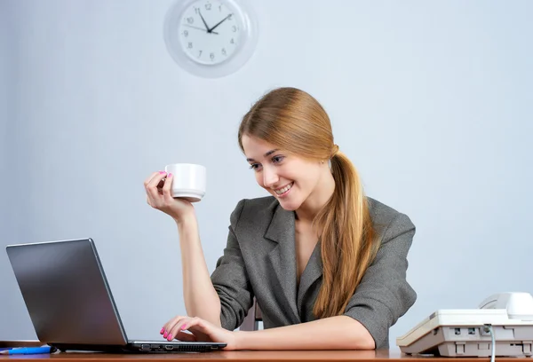 Beautiful businesswoman working on laptop — Stock Photo, Image