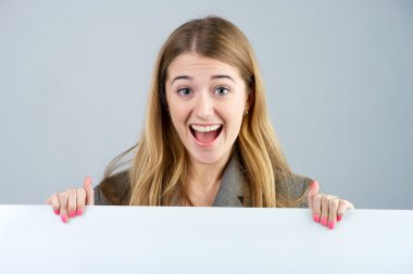 Young female holding a blank billboard clipart