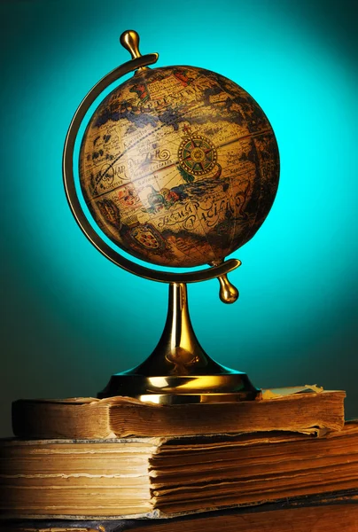 Stock image Antique globe on books