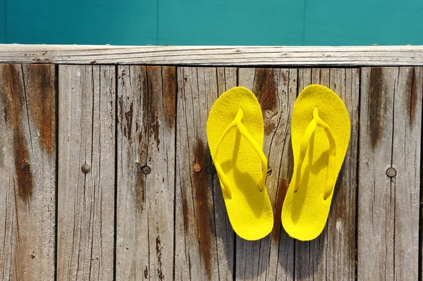 Sandals by a swimming pool — Stock Photo, Image