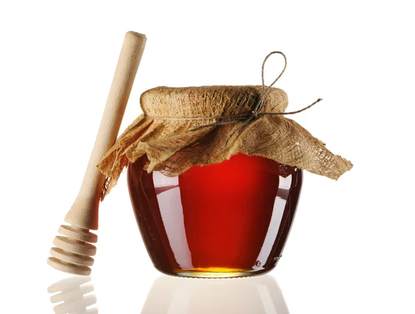 Jar of honey and dipper — Stock Photo, Image