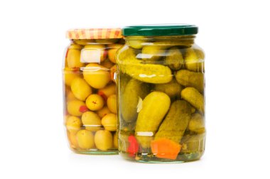 Pickled cucumbers and olives in glass jar clipart