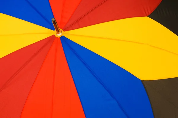 Close up de guarda-chuva colorido multi setor — Fotografia de Stock