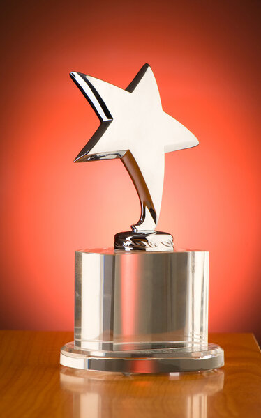 Star award against red gradient background