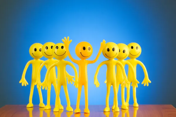Leadership concept with smilies against gradient background — Stock Photo, Image