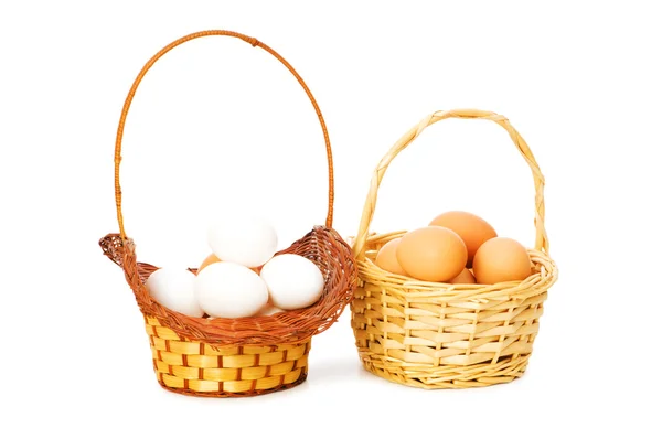 Basket full of eggs isolated on white — Stock Photo, Image