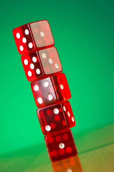 Stack of red casino dice against gradient background — Stock Photo, Image