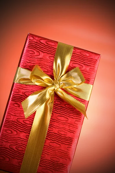 Gift box against gradient background Stock Photo
