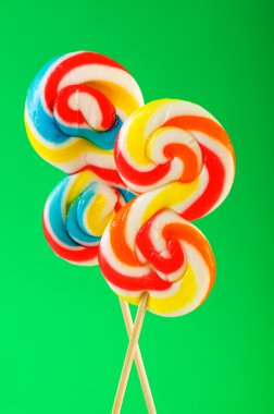 Colourful lollipop against the colourful background clipart