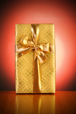 Gift box against gradient background clipart