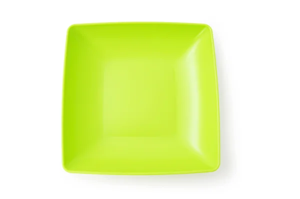 Green plate isolated on the white background — Stock Photo, Image