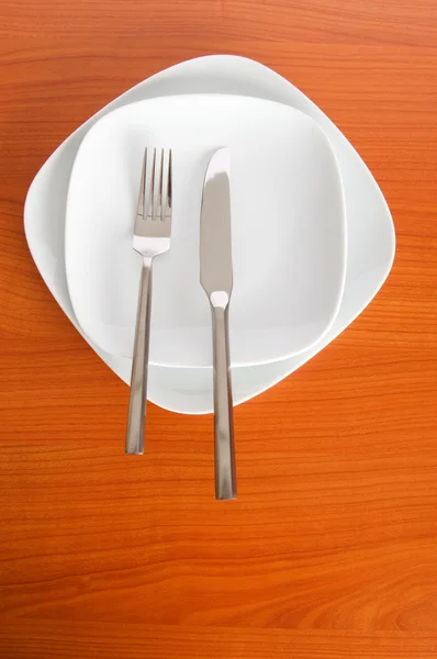 Conjunto de utensílios dispostos sobre a mesa — Fotografia de Stock