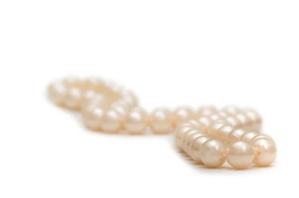 Pearl necklace on white - shallow depth of field — Stock Photo, Image