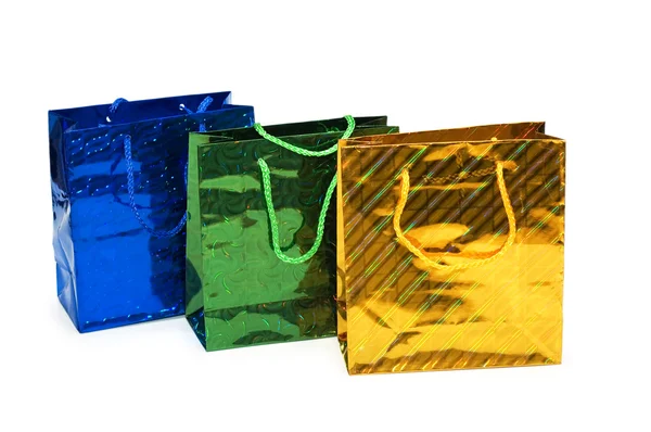 Üç alışveriş torbaları üzerinde beyaz izole — Stok fotoğraf