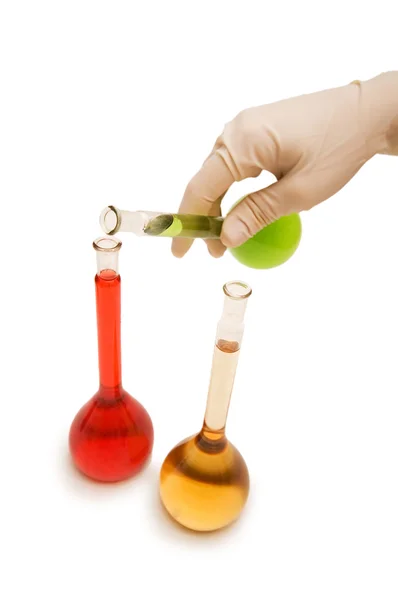 Mão com tubos vermelhos e verdes isolados em branco — Fotografia de Stock